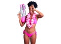 Young african american woman wearing bikini and hawaiian lei holding water gun smiling happy doing ok sign with hand on eye Royalty Free Stock Photo