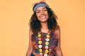 Young african american woman wearing bohemian and hippie style looking positive and happy standing and smiling with a confident