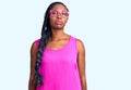 Young african american woman wearing casual clothes and glasses relaxed with serious expression on face Royalty Free Stock Photo