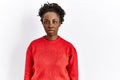 Young african american woman wearing casual clothes over isolated background relaxed with serious expression on face Royalty Free Stock Photo