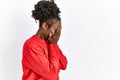Young african american woman wearing casual clothes over isolated background with sad expression covering face with hands while Royalty Free Stock Photo