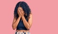 Young african american woman wearing casual clothes with sad expression covering face with hands while crying Royalty Free Stock Photo