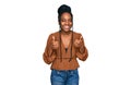 Young african american woman wearing casual clothes success sign doing positive gesture with hand, thumbs up smiling and happy Royalty Free Stock Photo