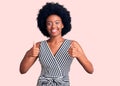 Young african american woman wearing casual clothes success sign doing positive gesture with hand, thumbs up smiling and happy Royalty Free Stock Photo