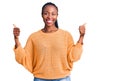 Young african american woman wearing casual clothes success sign doing positive gesture with hand, thumbs up smiling and happy Royalty Free Stock Photo