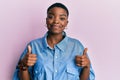 Young african american woman wearing casual clothes success sign doing positive gesture with hand, thumbs up smiling and happy Royalty Free Stock Photo
