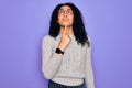 Young african american woman wearing casual sweater and glasses over purple background Thinking concentrated about doubt with Royalty Free Stock Photo