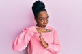 Young african american woman wearing casual winter sweater doing time out gesture with hands, frustrated and serious face Royalty Free Stock Photo