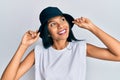 Young african american woman wearing fashion hat smiling looking to the side and staring away thinking Royalty Free Stock Photo