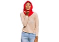 Young african american woman wearing traditional islamic hijab scarf looking at the camera blowing a kiss with hand on air being Royalty Free Stock Photo