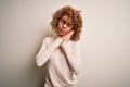 Young african american woman wearing turtleneck sweater and glasses over white background sleeping tired dreaming and posing with Royalty Free Stock Photo