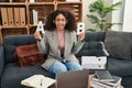 Young african american woman working speech problems at consultation office sticking tongue out happy with funny expression Royalty Free Stock Photo