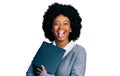 Young african american woman working using computer laptop sticking tongue out happy with funny expression Royalty Free Stock Photo