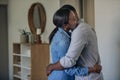 Affectionate young African American couple hugging each other at home Royalty Free Stock Photo