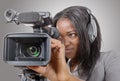 Young African American women with professional video camera and Royalty Free Stock Photo