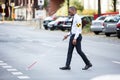 Blind Man Wearing Armband Walking With Stick Royalty Free Stock Photo