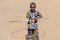 Young African Boy Playing Smiling Laughing Outdoors with Hula Ho Royalty Free Stock Photo