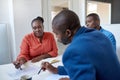 Young African business colleagues discussing paperwork in an office