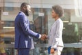 Young african business people shaking hands outdoors Royalty Free Stock Photo