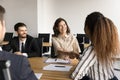 Young African business professional woman shaking hands with colleague woman Royalty Free Stock Photo