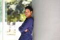Young african business woman leaning against wall Royalty Free Stock Photo