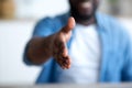 Young african businessman giving his hand for handshake to partner Royalty Free Stock Photo