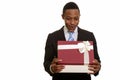 Young African businessman opening gift box and looking surprised Royalty Free Stock Photo