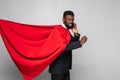 Young african businessman run and talking on the phone on white background Royalty Free Stock Photo