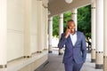 Young african businessman talking on mobile phone in the city Royalty Free Stock Photo