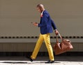 Young african businessman walking Wirth bag and mobile phone Royalty Free Stock Photo