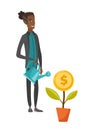 Young african businessman watering money flower.