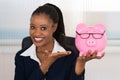 Smiling Businesswoman Holding Piggybank Royalty Free Stock Photo