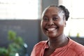 Young African businesswoman smiling confidently in an office Royalty Free Stock Photo