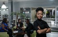 Young African businesswoman standing confidently in a modern office Royalty Free Stock Photo