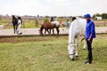 Young African children holding the reigns of a horse