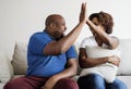 A young African couple success dealing together high five