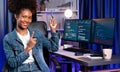 Young African IT developer presenting program and focus on camera. Tastemaker.