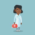 Young african doctor holding a first aid box. Royalty Free Stock Photo