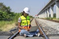 young african female engineer working on laptop to check railway tracks for maintenance at railroad Royalty Free Stock Photo