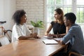 Young african female job seeker holding interview with hr managers. Royalty Free Stock Photo