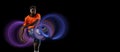 Young african football, soccer player in neon light on black background. Concept of motion and action in sport. Training