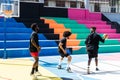 Young African friends playing basketball outdoor