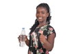 Young African girl with a bottle of mineral water Royalty Free Stock Photo