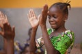 Young African Girl Concentrating On Her Hand Clapping Game