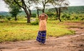 Young african girl posing in a Masai tribe village