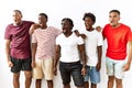 Young african group of friends standing together over isolated background angry and mad screaming frustrated and furious, shouting Royalty Free Stock Photo