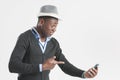 Young african guy looking at cell phone Royalty Free Stock Photo