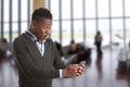 Young african guy looking at cell phone Royalty Free Stock Photo