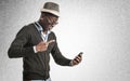 Young african guy looking at cell phone Royalty Free Stock Photo