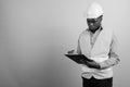 Young African man construction worker against white background Royalty Free Stock Photo